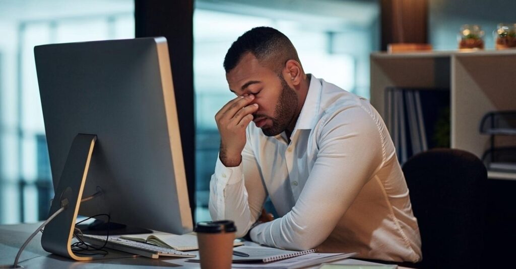 New business owner reviewing notes on first-time entrepreneur mistakes at her desk