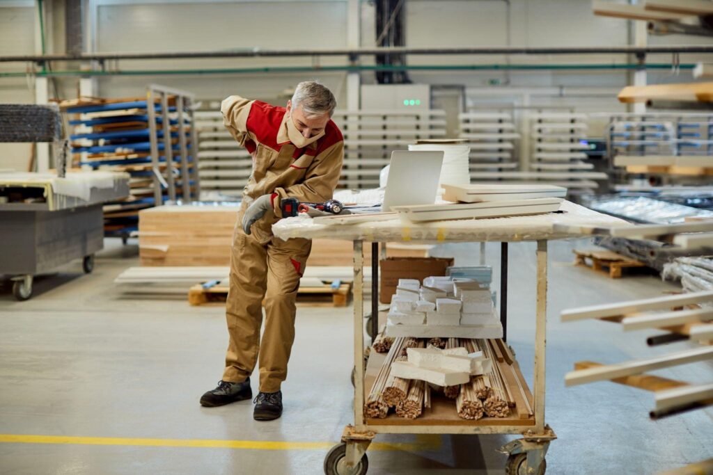 Operations manager reviewing a production line to identify the 7 types of waste