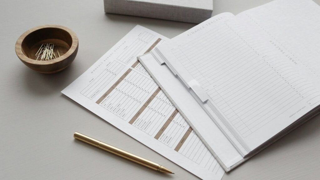 Business owner doing a break-even analysis with a calculator and financial report