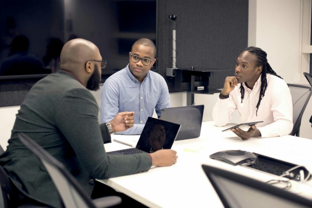SME owner reviewing a centralised reporting system dashboard on a laptop