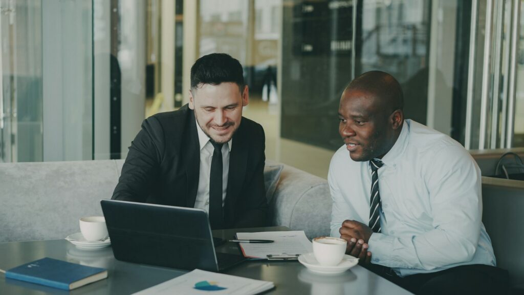 Account manager discussing customer retention strategies with a business client