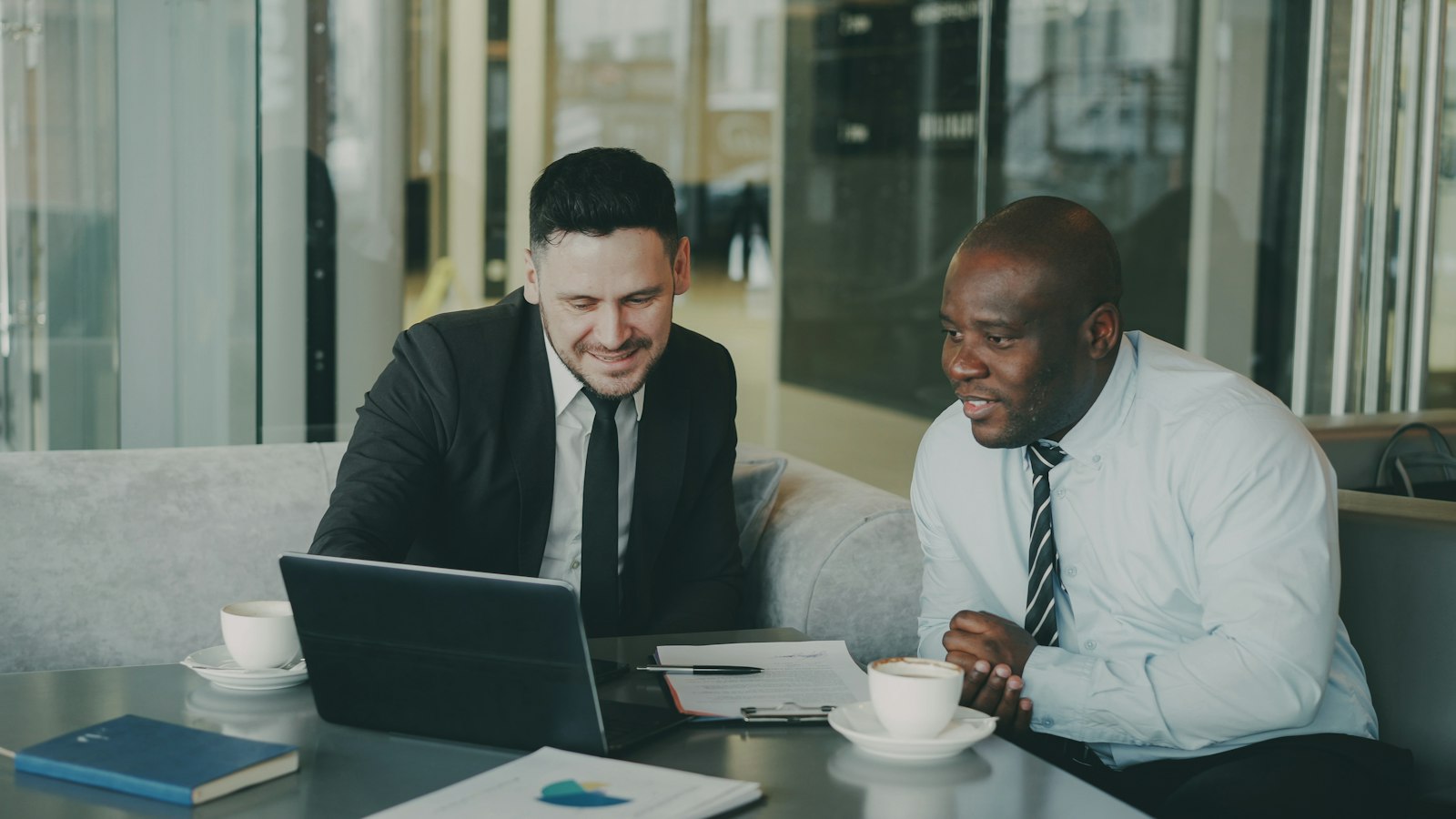 Account manager discussing customer retention strategies with a business client