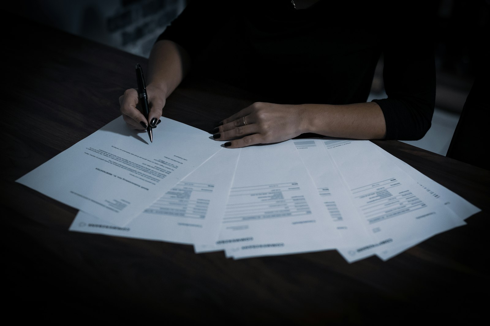 Business owner reading a printed profit and loss statement