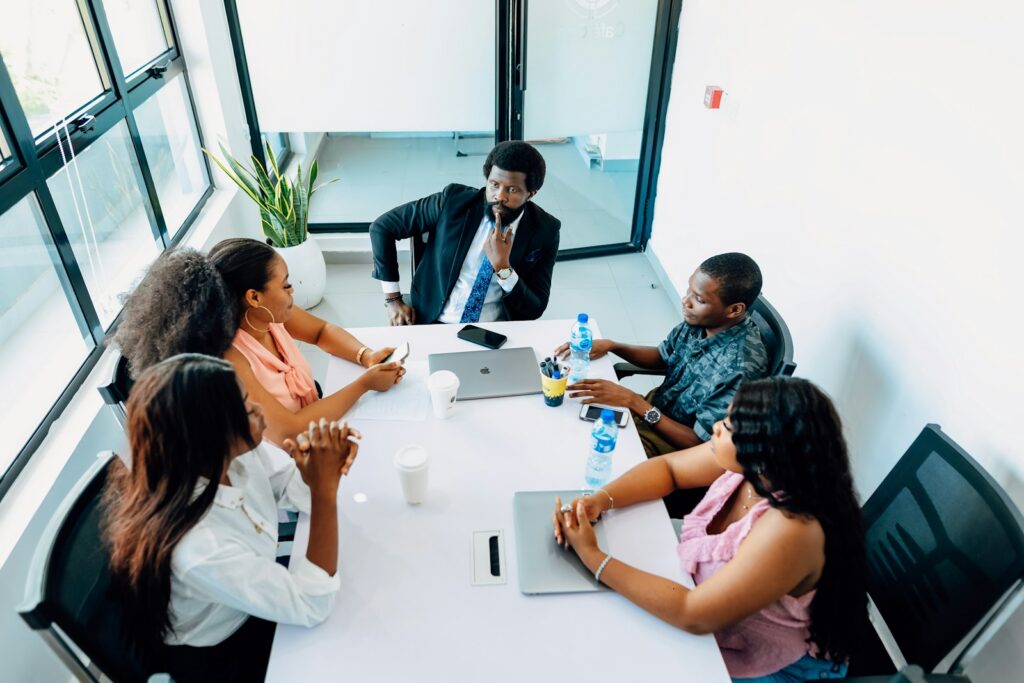 SME leadership team using a quarterly business review template in a boardroom meeting