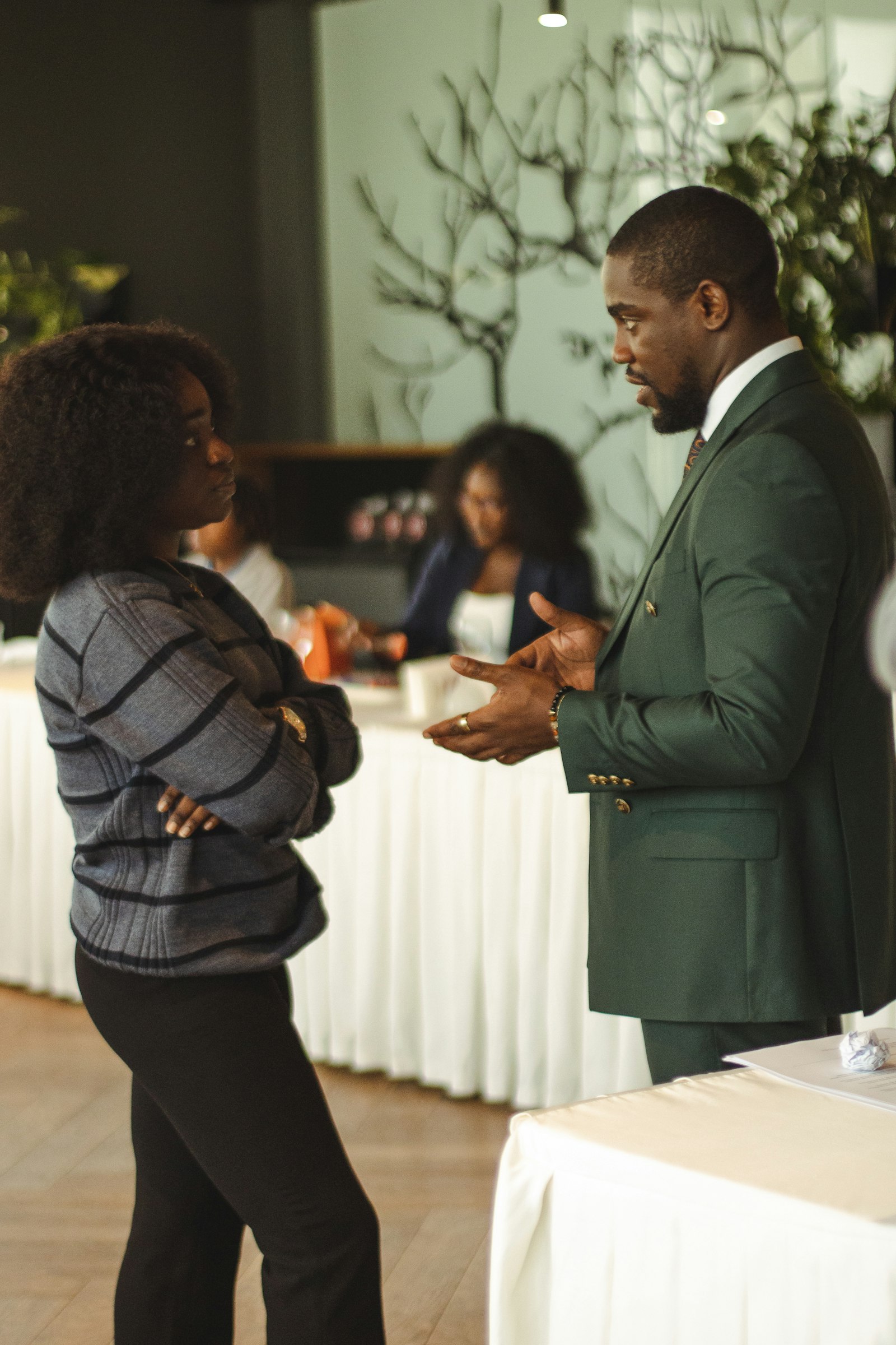 SME owner sharing value proposition examples with a client across a table